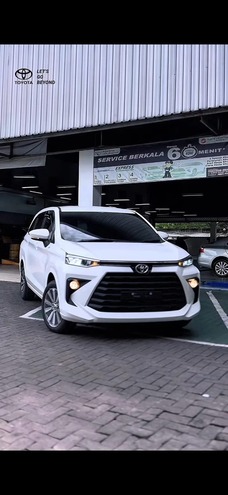White vehicle outside a service center